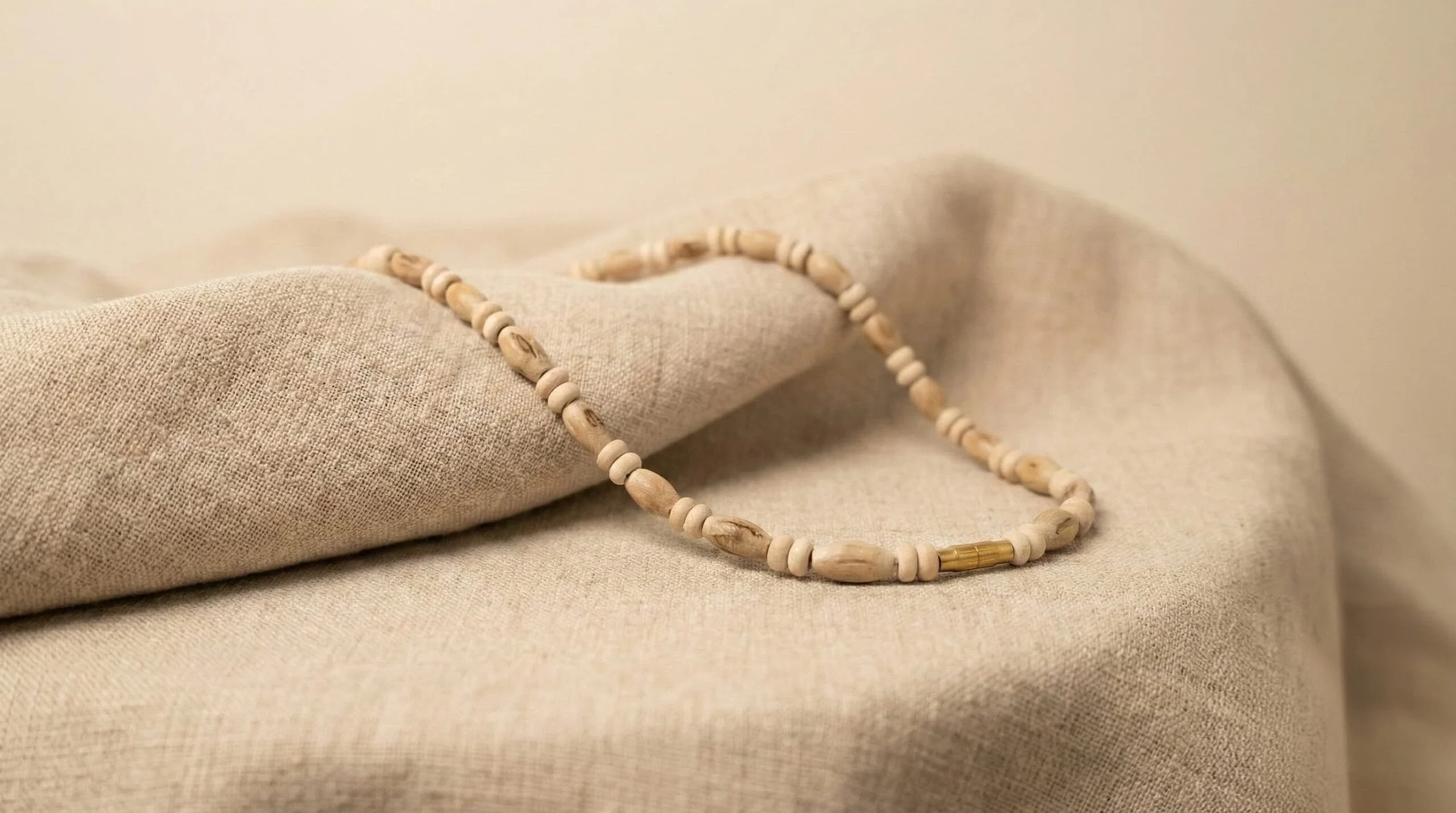 A tulsi mala arranged on neutral fabric